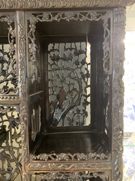 A richly carved Chinese hongmu display cabinet, Canton, 19th C.