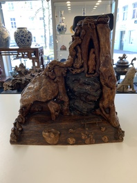 A Chinese carved wooden group and a natural root sculpture, 20th C.