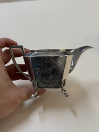 A Chinese silver covered teapot, sugar jar and milk jug with bamboo design, Tackhing 90% silver mark, 20th C.