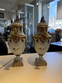 A pair of Chinese export famille rose urns and covers, Qianlong