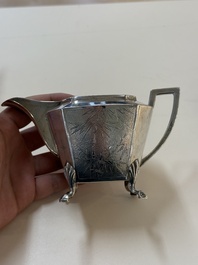 A Chinese silver covered teapot, sugar jar and milk jug with bamboo design, Tackhing 90% silver mark, 20th C.