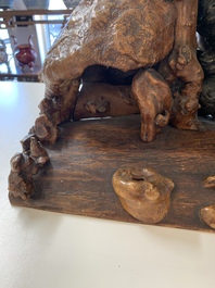 A Chinese carved wooden group and a natural root sculpture, 20th C.