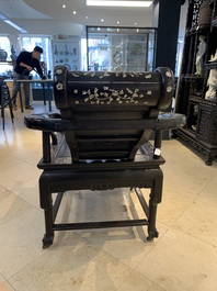 A Chinese mother-of-pearl-inlaid hongmu reclining armchair with a retractable footrest, Canton, 19th C.