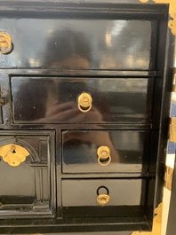 A rare Japanese black-lacquered cabinet with finely engraved gilt mounts, Edo, late 17th C.