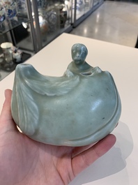 A Chinese celadon-glazed water dropper, a yellow-glazed ewer, a famille noire covered vase and a miniature model, 19th C.