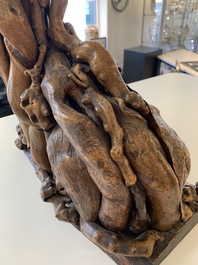 A Chinese carved wooden group and a natural root sculpture, 20th C.