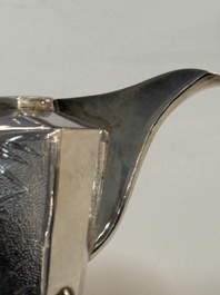 A Chinese silver covered teapot, sugar jar and milk jug with bamboo design, Tackhing 90% silver mark, 20th C.