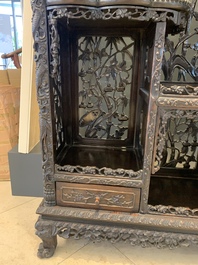 A richly carved Chinese hongmu display cabinet, Canton, 19th C.