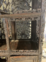 A richly carved Chinese hongmu display cabinet, Canton, 19th C.