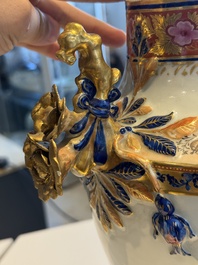 A pair of Chinese export famille rose urns and covers, Qianlong