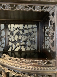 A richly carved Chinese hongmu display cabinet, Canton, 19th C.