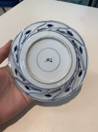 18 Chinese blue and white cups and 16 saucers with floral design, jade mark, Kangxi