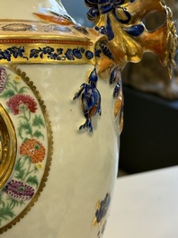 A pair of Chinese export famille rose urns and covers, Qianlong