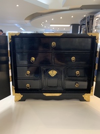 A rare Japanese black-lacquered cabinet with finely engraved gilt mounts, Edo, late 17th C.