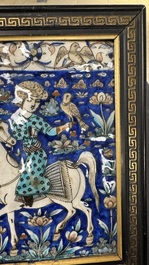 A rectangular Qajar relief-moulded tile with a prince on horseback, Iran, 19th C.