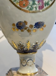 A pair of Chinese export famille rose urns and covers, Qianlong