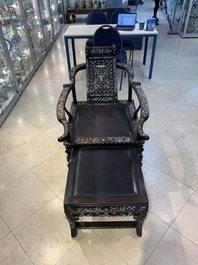 A Chinese mother-of-pearl-inlaid hongmu reclining armchair with a retractable footrest, Canton, 19th C.