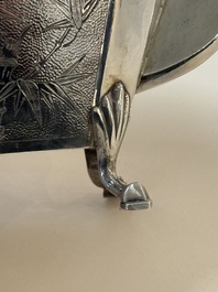 A Chinese silver covered teapot, sugar jar and milk jug with bamboo design, Tackhing 90% silver mark, 20th C.
