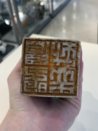 Two Chinese snuff bottles, four soapstone seals and a lacquer covered box, 20th C.