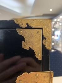 A rare Japanese black-lacquered cabinet with finely engraved gilt mounts, Edo, late 17th C.