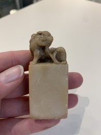 Two Chinese snuff bottles, four soapstone seals and a lacquer covered box, 20th C.