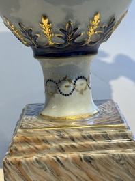 A pair of Chinese export famille rose urns and covers, Qianlong