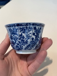 18 Chinese blue and white cups and 16 saucers with floral design, jade mark, Kangxi