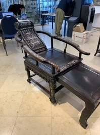 A Chinese mother-of-pearl-inlaid hongmu reclining armchair with a retractable footrest, Canton, 19th C.