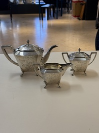 A Chinese silver covered teapot, sugar jar and milk jug with bamboo design, Tackhing 90% silver mark, 20th C.
