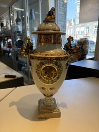A pair of Chinese export famille rose urns and covers, Qianlong