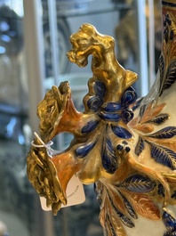 A pair of Chinese export famille rose urns and covers, Qianlong