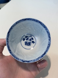 18 Chinese blue and white cups and 16 saucers with floral design, jade mark, Kangxi