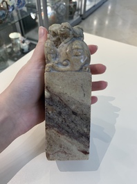 Two Chinese snuff bottles, four soapstone seals and a lacquer covered box, 20th C.