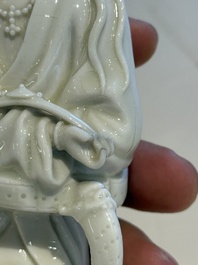 Two Chinese Dehua blanc de Chine figures of Guanyin and Shoulao and a pair of Buddhist lions, He Chaozong 何朝宗 mark, 18/19th C.