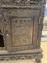 A richly carved Chinese hongmu display cabinet, Canton, 19th C.