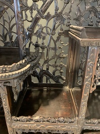 A richly carved Chinese hongmu display cabinet, Canton, 19th C.