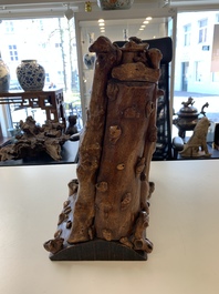 A Chinese carved wooden group and a natural root sculpture, 20th C.