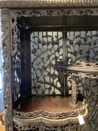 A richly carved Chinese hongmu display cabinet, Canton, 19th C.