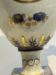 A pair of Chinese export famille rose urns and covers, Qianlong