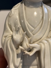 Two Chinese Dehua blanc de Chine figures of Guanyin and Shoulao and a pair of Buddhist lions, He Chaozong 何朝宗 mark, 18/19th C.