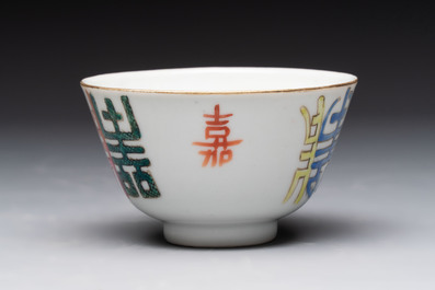 A Chinese blue and white vase, a jar, a famille rose cup and a plaque, signed He Xuren 何許人, 19th C.
