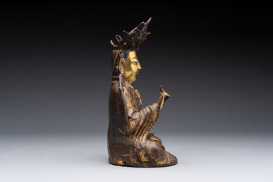 A Chinese parcel-gilt bronze Guanyin, Ming