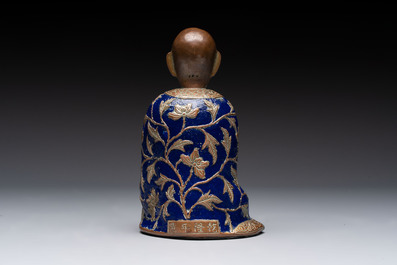 A Chinese champlev&eacute; figure of Luohan, Qianlong mark, 18/19th C.