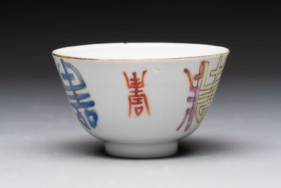 A Chinese blue and white vase, a jar, a famille rose cup and a plaque, signed He Xuren 何許人, 19th C.