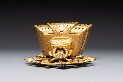 A Nepalese gilt-bronze Buddha on an inscribed throne with a mandorla, 19th C.