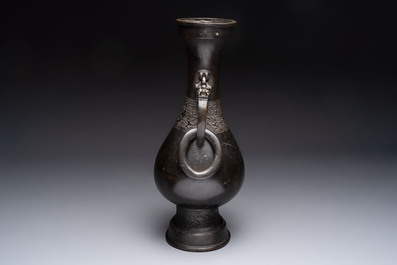 A large Chinese bronze 'hu' vase with luduan-form handles, Yuan