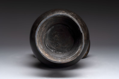 A large Chinese bronze 'hu' vase with luduan-form handles, Yuan