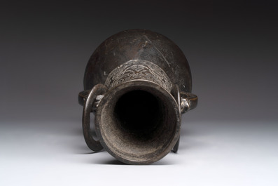 A large Chinese bronze 'hu' vase with luduan-form handles, Yuan