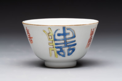 A Chinese blue and white vase, a jar, a famille rose cup and a plaque, signed He Xuren 何許人, 19th C.