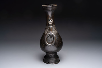A large Chinese bronze 'hu' vase with luduan-form handles, Yuan